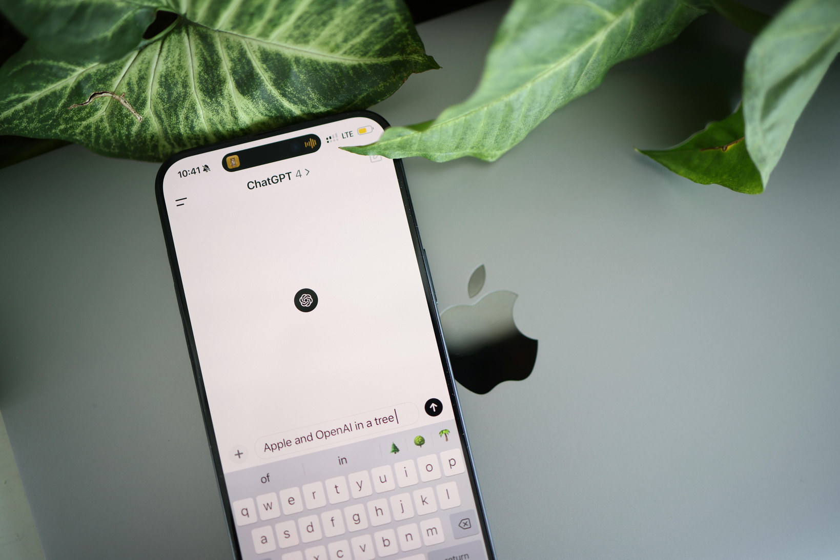 A close up of an iphone with a keyboard on it